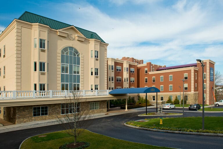 A welcoming senior living residence with landscaped grounds